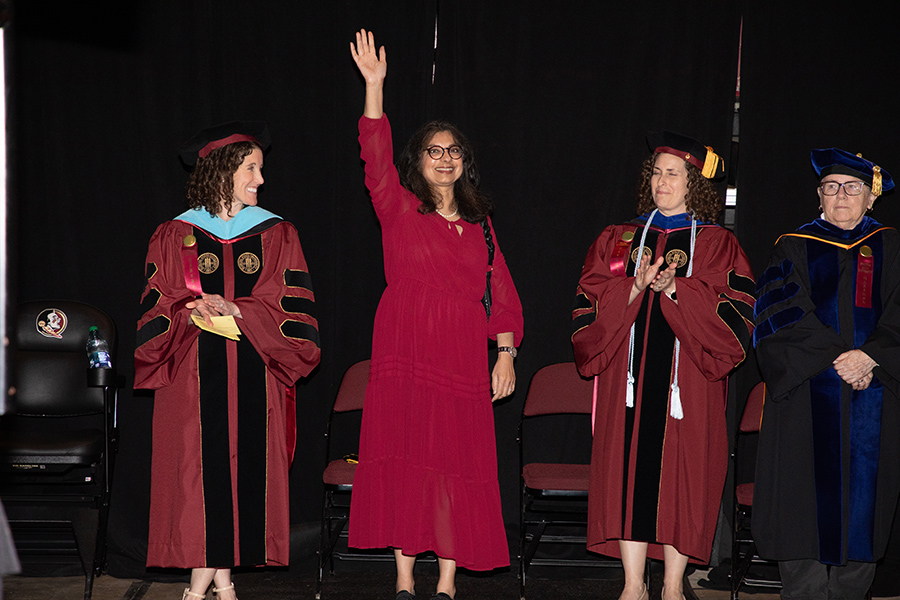 Florida State University's First Lady Dr. Jai Vartikar waves during the spring commencement Friday, May 5, 2023, at the Donald L. Tucker Civic Center. (FSU Photography)