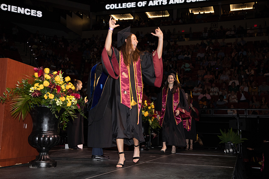 A Florida State University graduate celebrates during the spring commencement Friday, May 5, 2023, at the Donald L. Tucker Civic Center. (FSU Photography Services)