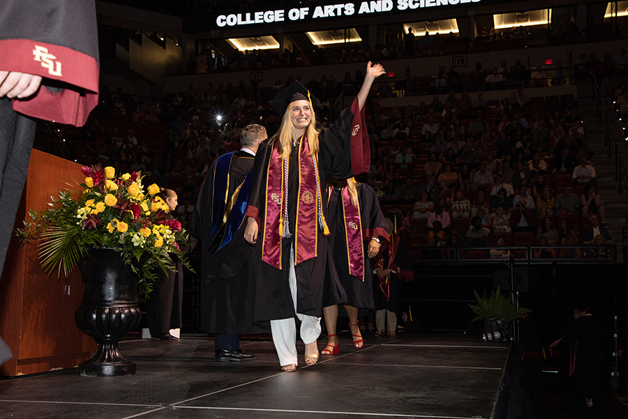 A Florida State University graduate celebrates during the spring commencement Friday, May 5, 2023, at the Donald L. Tucker Civic Center. (FSU Photography Services)
