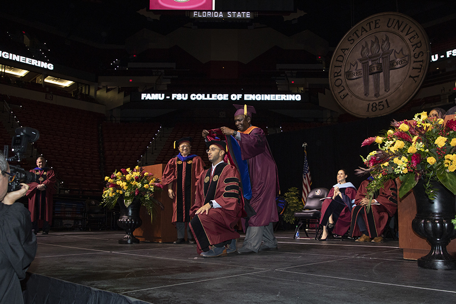 A Florida State University faculty member hoods a doctoral graduate during the university’s spring doctoral hooding ceremony Friday, May 5, 2023, at the Donald L. Tucker Civic Center. (FSU Photography)