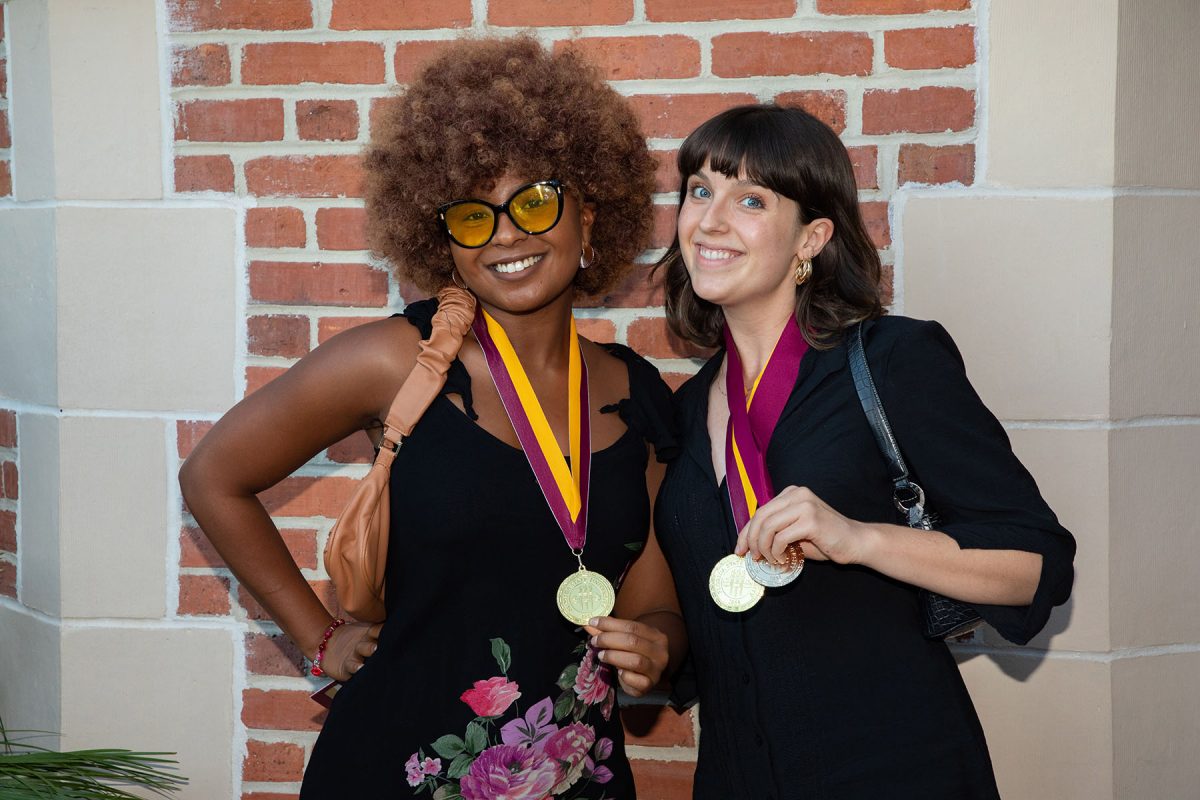Nia Alexander, University Honors graduate and Allison Crawford, Outstanding Senior Scholar, pose for a photo following the ceremony