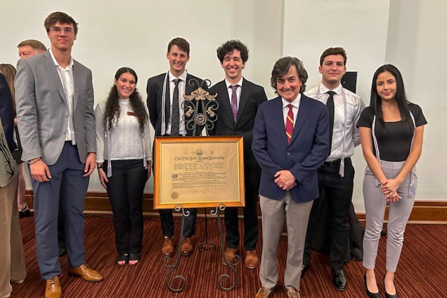 Provost and Executive Vice President for Academic Affairs Jim Clark stands with newly inducted members of Florida State University’s Alpha of Florida Chapter of the Phi Beta Kappa April 27, 2023, at Miller Hall.