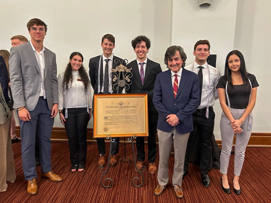 Provost and Executive Vice President for Academic Affairs Jim Clark stands with newly inducted members of Florida State University’s Alpha of Florida Chapter of the Phi Beta Kappa April 27, 2023, at Miller Hall.