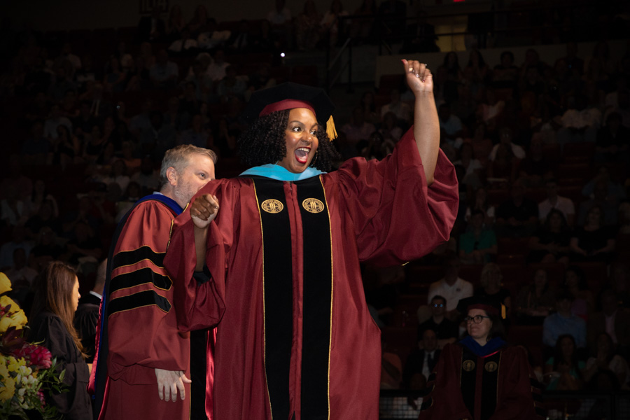 A Florida State University graduate celebrates during the spring commencement Saturday, May 6, 2023, at the Donald L. Tucker Civic Center. (FSU Photography Services)