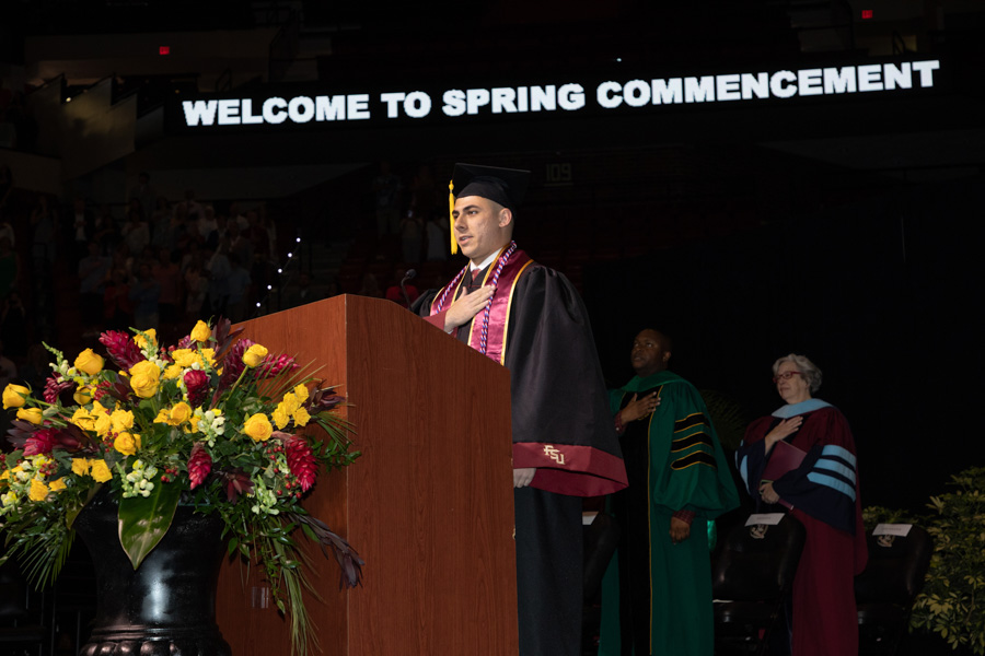 Florida State University graduate Max Sherman delivers the Pledge of Allegiance during the spring commencement Saturday, May 6, 2023, at the Donald L. Tucker Civic Center. (FSU Photography Services)
