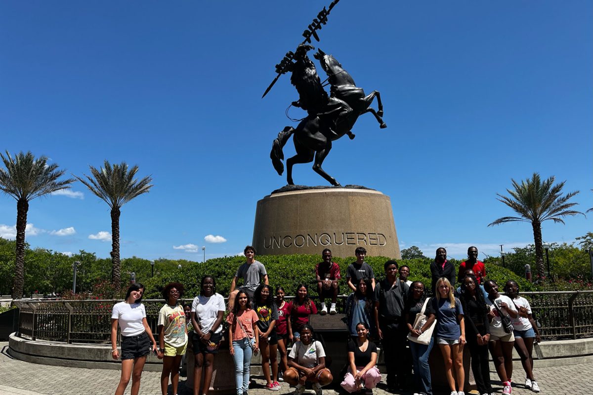 Students attending the second session of the Summer Seminoles Program commemorate their FSU Athletics tour with a photo at the iconic Unconquered statute.