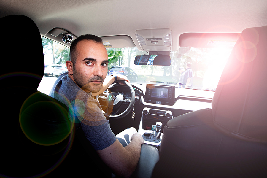 Mohammadreza Koloushani, a doctoral candidate at the FAMU-FSU College of Engineering, sits in a car. His research into sun glare blindness in drivers could help deliver innovative solutions that prevent crashes. (Mark Wallheiser/FAMU-FSU College of Engineering)