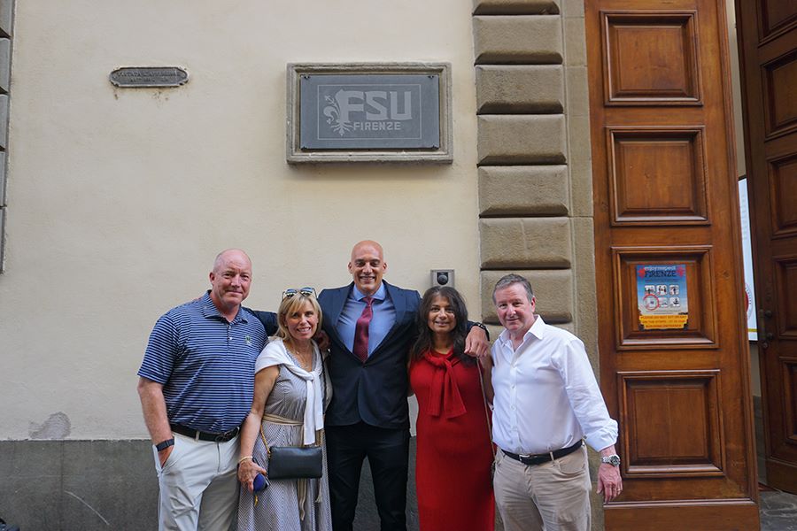 FSU Board of Trustees Chair Peter Collins, International Programs board member Jennifer Collins, FSU Florence Director Charles Panarella, First Lady Jai Vartikar and President Richard McCullough in front of the entrance to the FSU Florence Study Center.