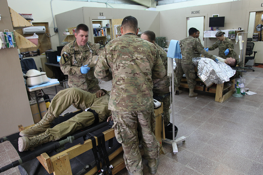 U.S. soldiers caring for patients during a drill on Forward Operating Base Gamberi, Laghman province, Afghanistan in 2013. (U.S. Army photo by Spc. Andrew Claire Baker/Released)