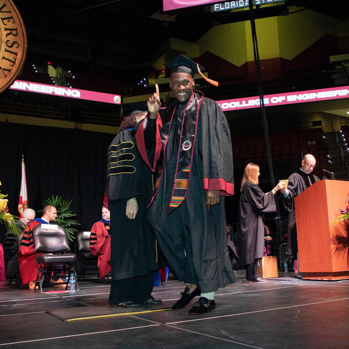 A Florida State University graduate celebrates during summer commencement Friday, Aug. 4, 2023, at the Donald L. Tucker Civic Center. (FSU Photography Services)