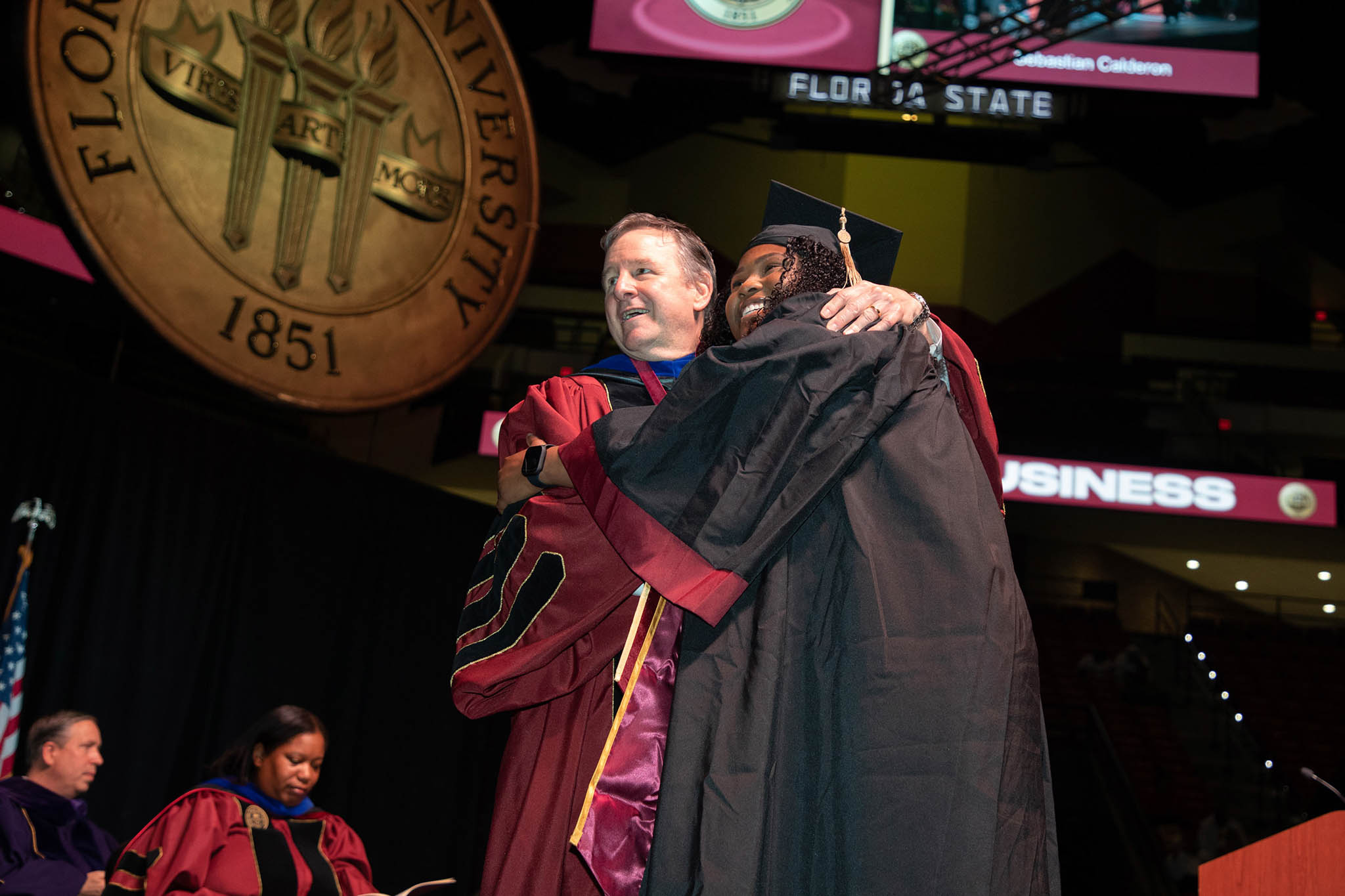 Florida State University President Richard McCullough congratulates graduate at the summer commencement ceremony Friday, Aug. 4 at the Donald L. Tucker Civic Center. (FSU Photography Services)