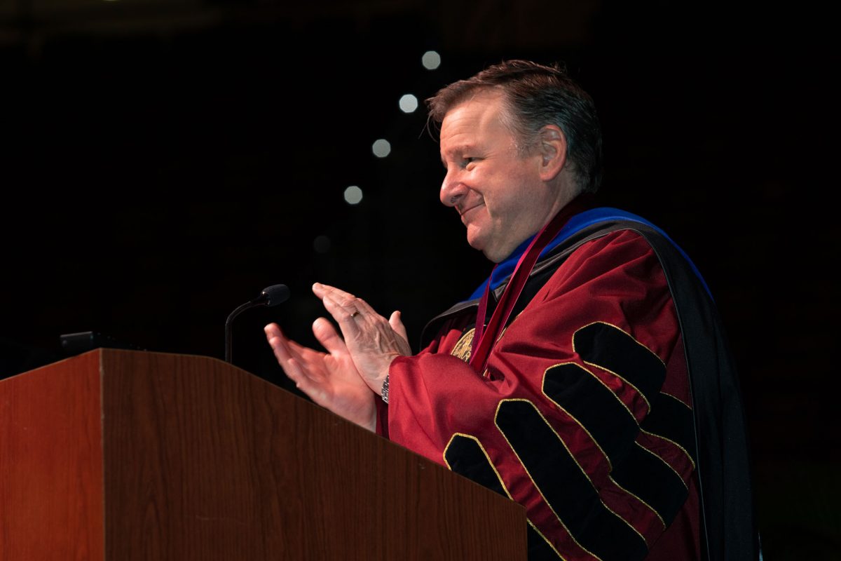 Florida State University President Richard McCullough congratulates graduates and their guests at the university’s summer doctoral hooding ceremony Friday, Aug. 4, 2023, at the Donald L. Tucker Civic Center. (FSU Photography)