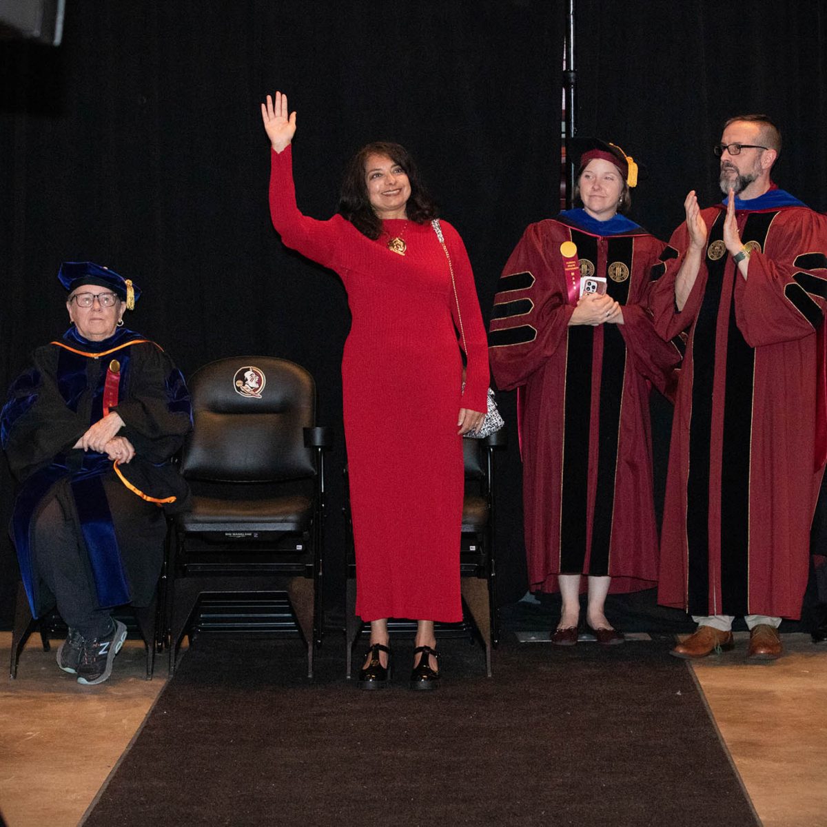 First Lady Jai Vartikar waves during summer commencement Friday, Aug. 4, 2023, at the Donald L. Tucker Civic Center. (FSU Photography Services)