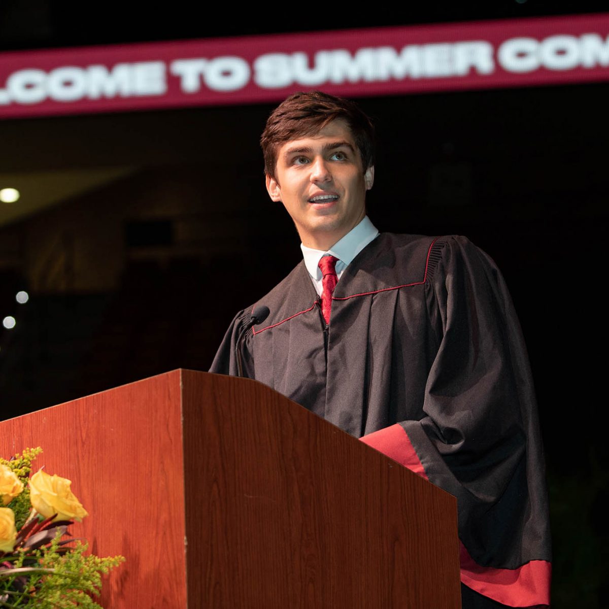 Student Body President Jack Hitchcock welcomes graduates and guests at the summer commencement ceremony Friday, Aug. 4 at the Donald L. Tucker Civic Center. (FSU Photography Services)