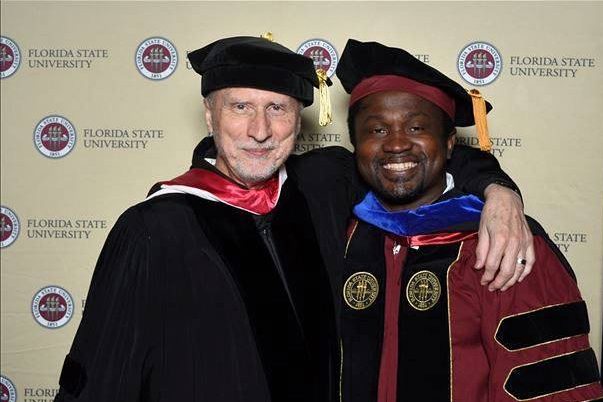 Krafft Professor of English and Pulitzer Prize Laureate Robert Olen Butler and Iheoma Nwachukwu celebrate the latter's 2018 doctoral degree. (Photo: Robert Butler)