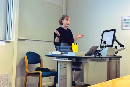 Michelle Kazmer presenting her 45-minute keynote, “Somerset House, Selfridges, and the Castanets of Bronze: Information Systems in the Works of Agatha Christie." (Photo: Agatha Christie Conference via X)