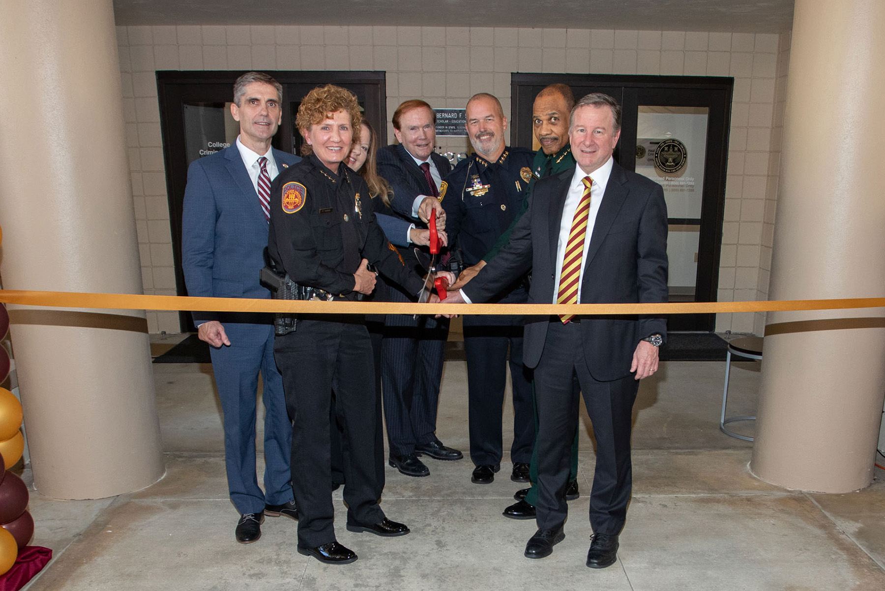 Leaders of the Tallahassee area’s law enforcement agencies joined city, county and Florida State University officials Friday, Sept. 15, 2023 to cut the ribbon on the new Capital Region Real Time Crime Center. (From left) , FSU Assistant Vice President for Public Safety and Chief of Police Rhonda Harris, Leslie Rabon, a certified law enforcement analyst and director of the CRRTCC, Thomas G. Blomberg, dean of the FSU College of Criminology and Criminal Justice, Chief Lawrence Revell of the Tallahassee Police Department, Sherriff Walt McNeil and FSU President Richard McCullough.