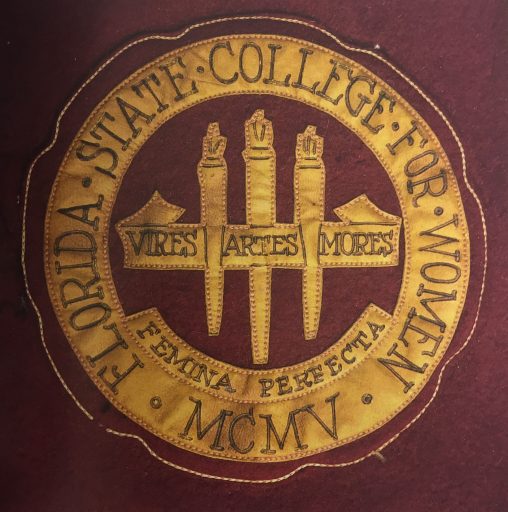 In 1909, “Agnes Granberry, an art student and member of the class of 1912 designed the new seal. It consisted of 3 torches with the words: Vires. Artes. Mores.(Strength. Skill. Customs.) on a banner and signified the mission of the college to educate students physically, mentally, and morally: to create Femina Perfecta, the Completed Woman.” Robin Sellers, Femina Perfecta. (Image courtesy of "FSU Voices")