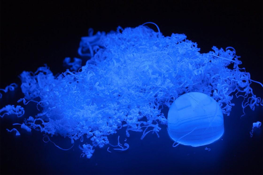 Polymer shavings sphere glow blue under an ultraviolet lamp. This photo earned the 2014 Chemistry Photo of the Year award from Chemical & Engineering News. (Courtesy of Kan Hanson)