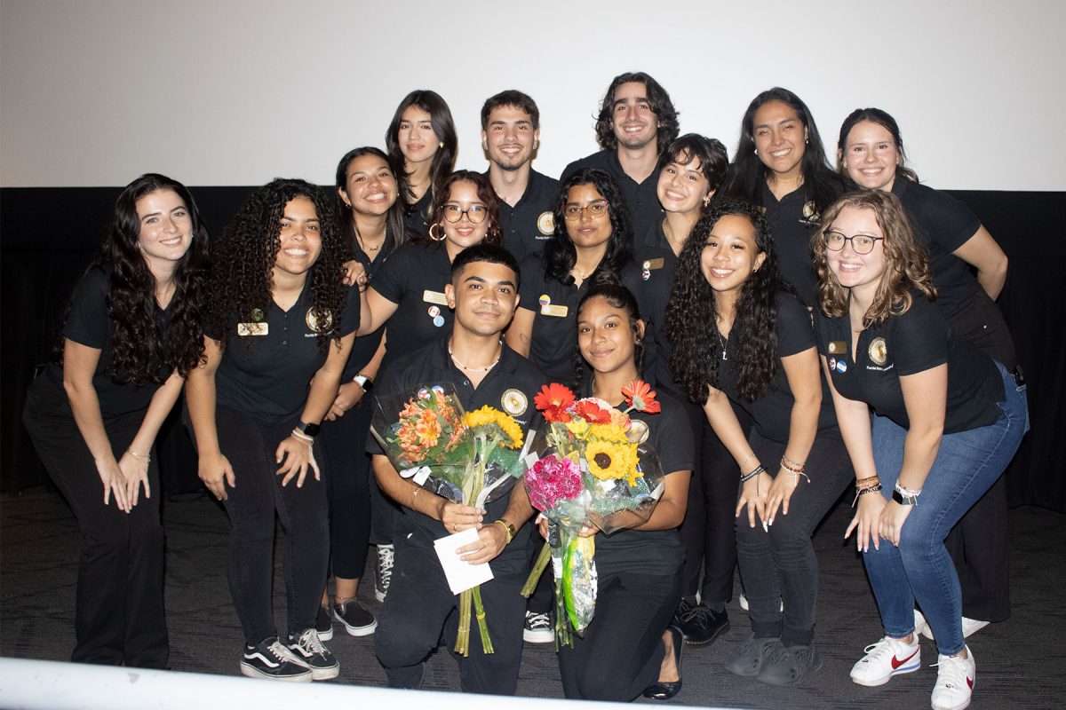 Maximo Valdes and Nicole Alvarado (L to R with flowers) and Javier Puebla (back row second from L) use their roles on the executive board of the Hispanic/Latinx Student Union to help others find the same welcoming community they have found at FSU. (Hispanic/Latinx Student Union)