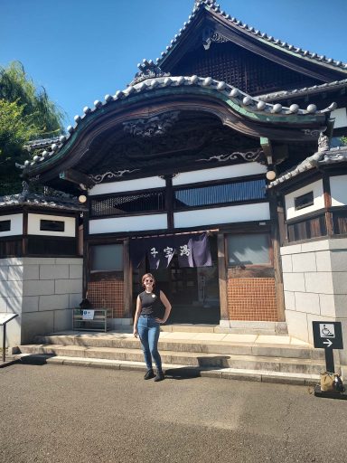 Rosalyn Wadsworth, a senior anthropology major and Japanese minor who won an IDEA Grant funded by the Tyler Center for Global Studies to study in Japan during the summer, poses outside of an early 20th century bathhouse at the Edo-Tokyo Open-Air Architectural Museum.