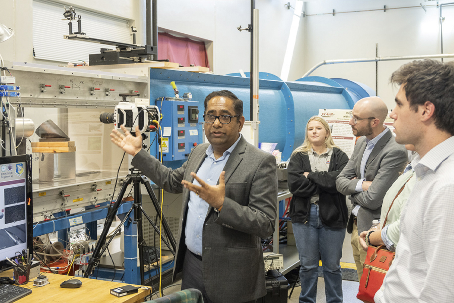 Rajan Kumar, director of the Florida Center for Advanced Aero-Propulsion, leads a tour of the facility during the AEROMORPH Center of Excellence kickoff event. (Jonas Gustavsson/Florida Center for Advanced Aero-Propulsion)