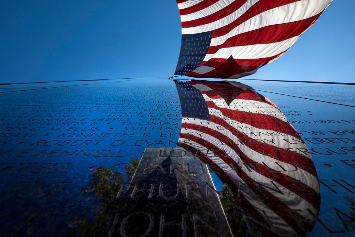 The Florida Vietnam Veterans' Memorial in downtown Tallahassee showcases a 40-foot American flag between two granite towers bearing the names of Florida's Vietnam casualties and soldiers missing in action. (Bruce Palmer, FSU Photography)