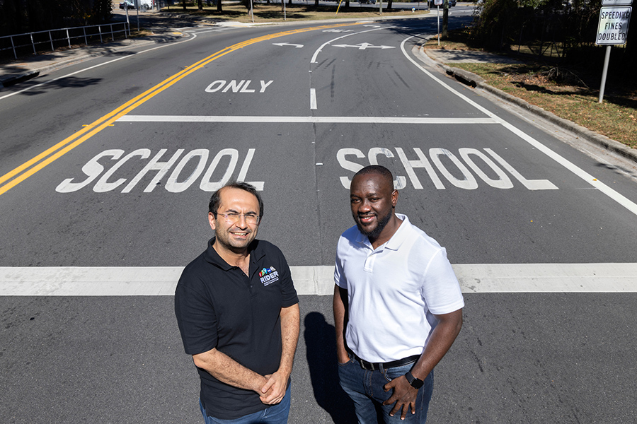 From left, Eren Erman Ozguven, a professor of Civil and Environmental Engineering at the FAMU-FSU College of Engineering, and graduate student Richard Antwi. They are working on a study that uses computer vision tools to map roadway geometry in Florida school zones. (Mark Wallheiser/FAMU-FSU College of Engineering)