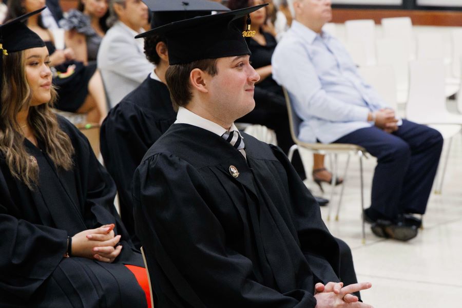 FSU-Panama Class of 2023 graduate José Vilar listens to speakers during a commencement ceremony Tuesday, Dec. 5, at the City of Knowledge Convention Center in Panama City, Panama. (FSU-Panama, Pedro Ahues)