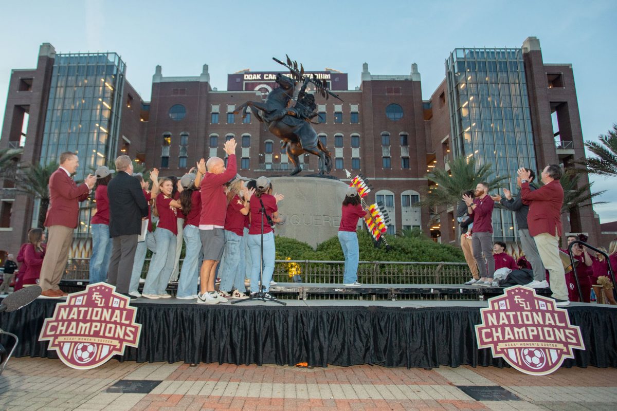 Florida State Women's Soccer team members celebrate their win at the championship celebration at the Unconquered Statue, Dec. 5, 2023. (FSU Photography)