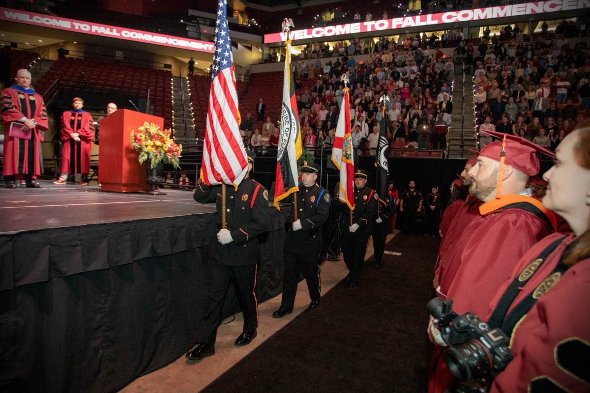 Members of the Seminole Tribe of Florida serve as color guard during Florida State University's fall doctoral hooding ceremony Friday, Dec. 15, 2023, at the Donald L. Tucker Civic Center. (FSU Photography Services)