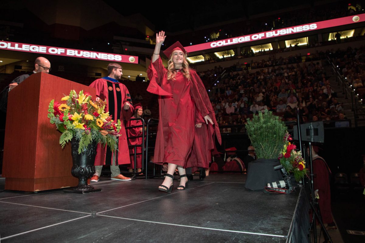 A student celebrates during commencement Friday, Dec. 15, 2023, at the Donald L. Tucker Civic Center. (FSU Photography Services)