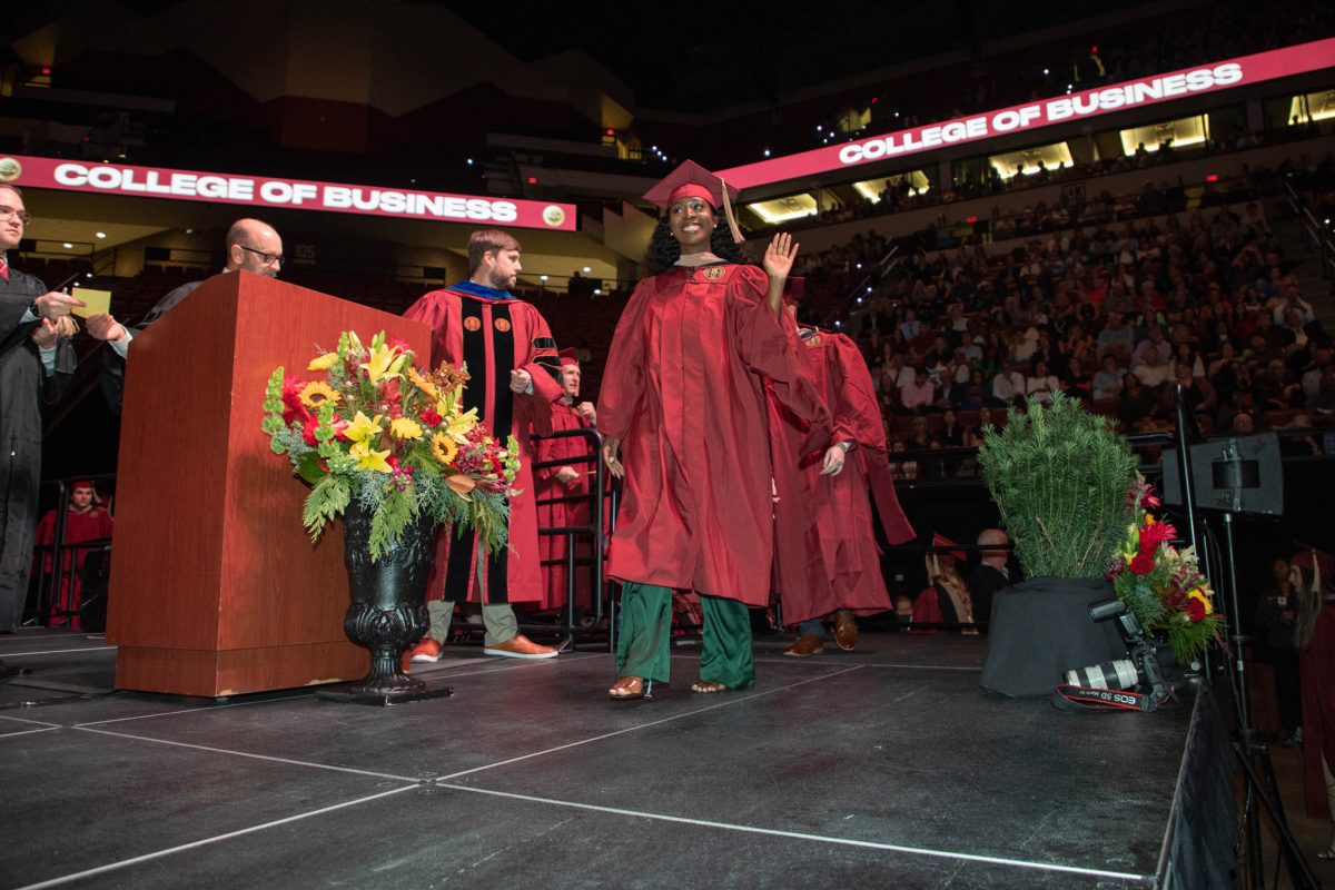 A graduate celebrates during commencement Friday, Dec. 15, 2023, at the Donald L. Tucker Civic Center. (FSU Photography Services)