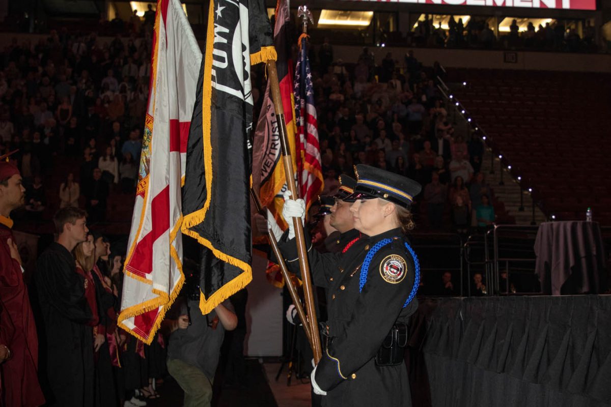 Members of Seminole Tribe of Florida serve as the color guard for FSU commencement. (FSU Photography Services)