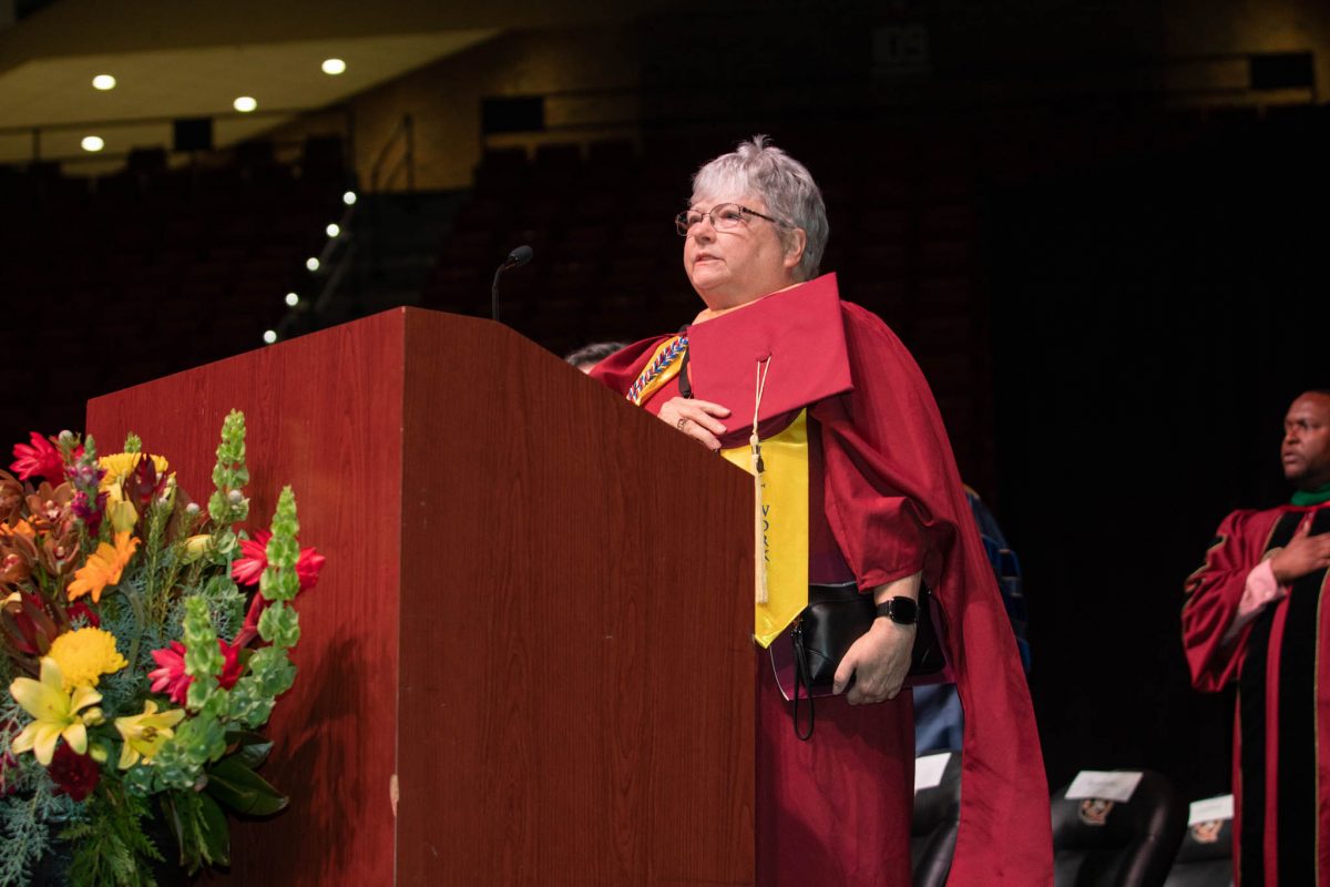 Dawn Campbell-Curie leads the Pledge of Allegiance. Campbell-Curie is a retired United States Air Force lieutenant colonel. She graduated with a master’s of social work. (FSU Photography Services)