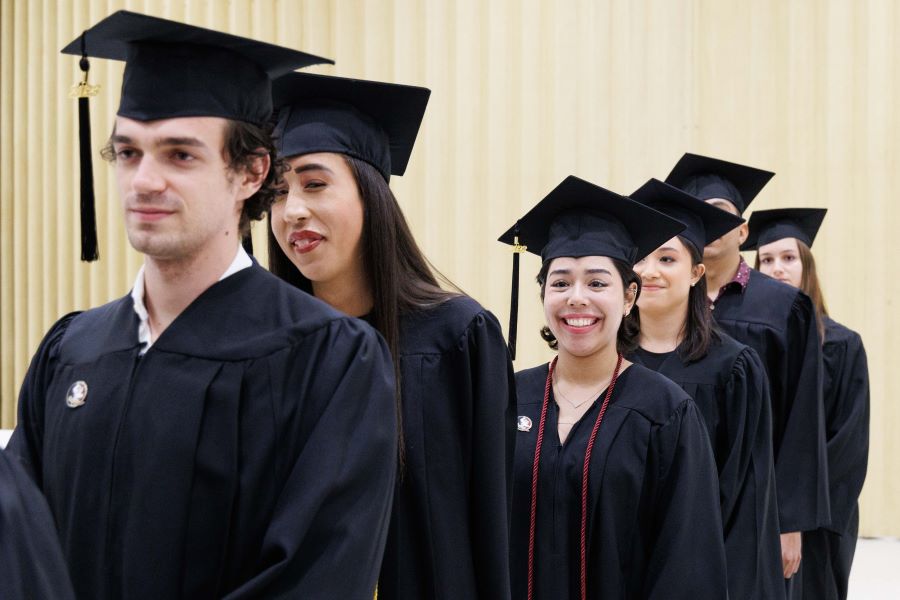 Graduates of the FSU-Panama Class of 2023 line-up to walk across the stage during a commencement ceremony Tuesday, Dec. 5, at the City of Knowledge Convention Center in Panama City, Panama. (FSU-Panama, Pedro Ahues)