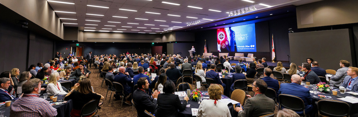 An overflow crowd of more than 200 business and organizational leaders listens to emcee Michael Hartline, dean of the FSU College of Business, during the inaugural FSU Business of Healthcare Summit. (College of Business)
