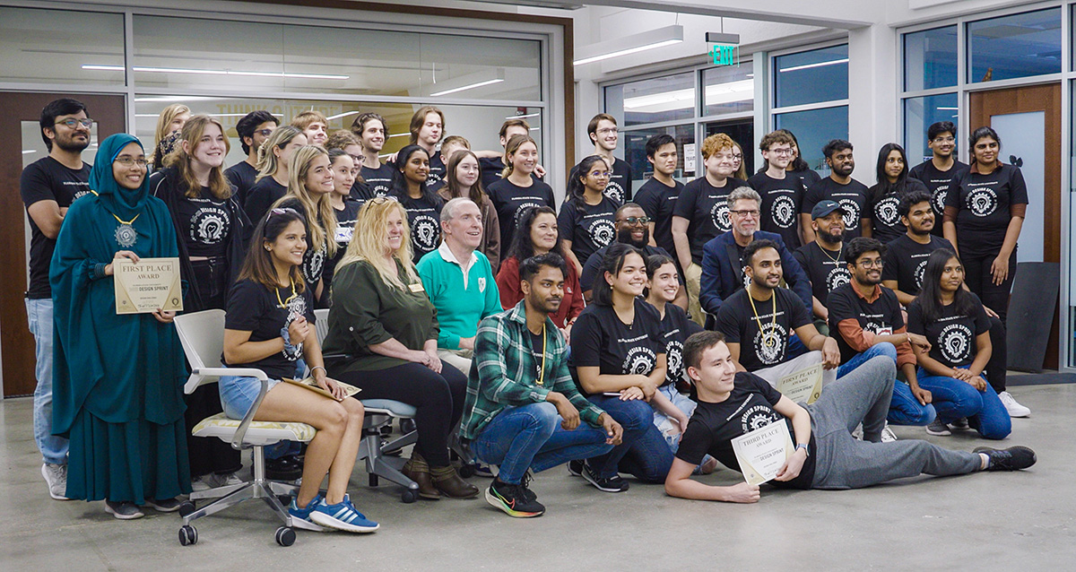 Participants and speakers gather for a photo for the 24-hour design sprint Friday, Jan. 26, and Saturday, Jan. 27, at the Innovation Hub.