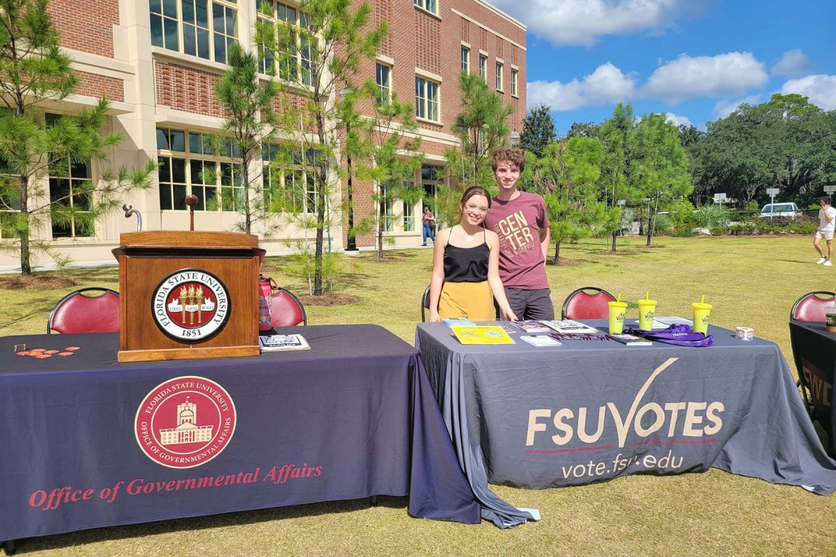 Students table for FSU Votes in front of the Student Union. (Center for Leadership & Service)