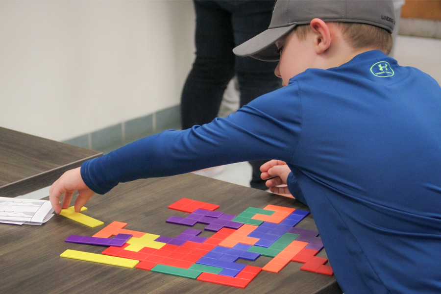 Attendees could participate in a variety of activities, including games exploring geometric construction and symmetries and patterns. (Carly Nelson/College of Arts and Sciences)