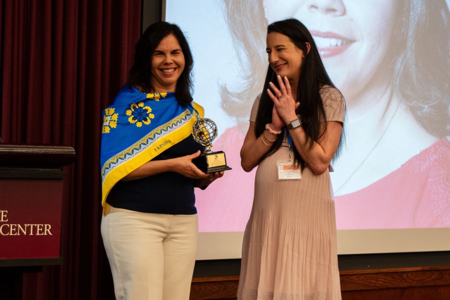 Vilma Fuentes, director of FSU’s Ukraine Task Force and a visiting associate in research at Learning Systems Institute (LSI), accepts FAIE's "You Made a World of a Difference" award from Victoria Dolce, FAIE Chair and associate director of International Student Support & Engagement at the University of Florida's International Center. (FSU Center for Global Engagement/Seamus Toner)