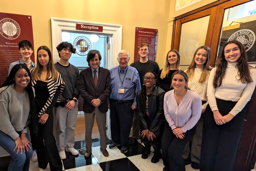 FSU Provost Jim Clark and director of International Programs Jim Pitts at the FSU London Study Centre with students currently studying there. (International Programs)