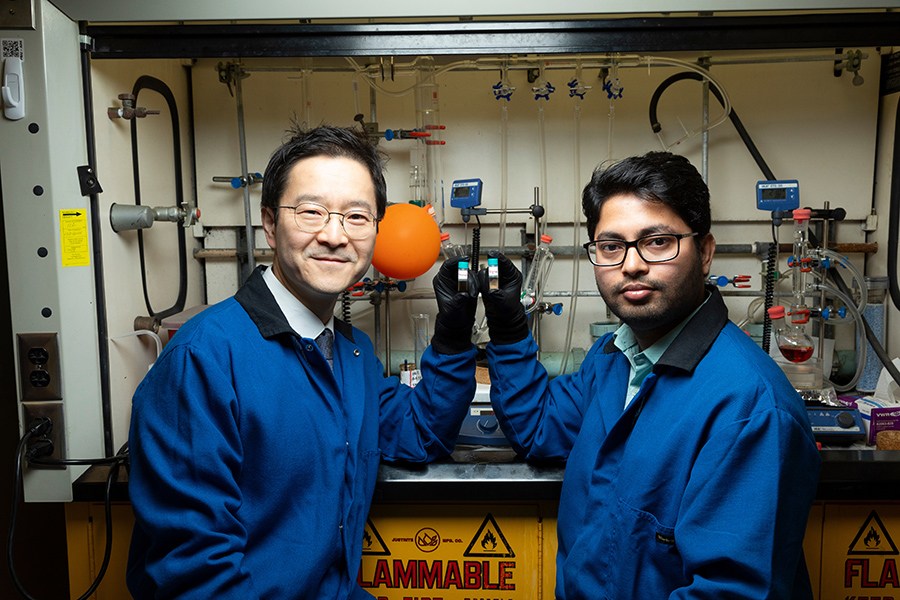 From left, Associate Professor Hoyong Chung and postdoctoral researcher Arijit Ghorai display the two phases of their degradable polymer at the Dittmer Chemistry Lab at Florida State University. (Scott Holstein/FAMU-FSU College of Engineering)