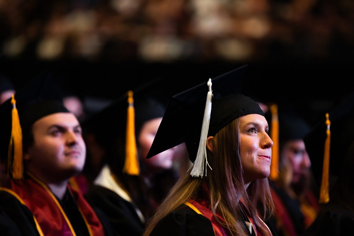 Graduate Elizabeth Colton listens to the commencement speech by U.S. Representative Neal Dunn during FSU's spring graduation ceremony at 7 p.m. Friday, May 3, 2024 at the Donald L. Tucker Center. (Matthew McConnell)
