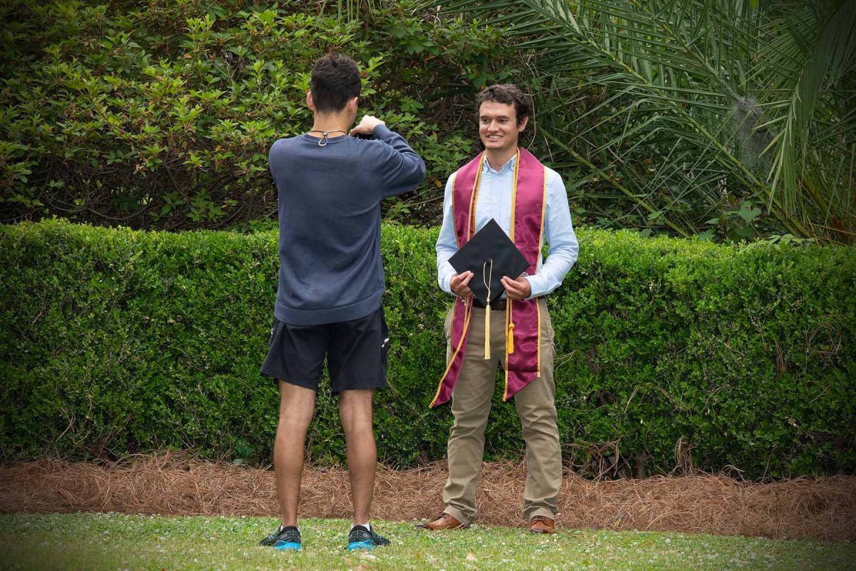 A graduate poses for photos at Westcott Plaza on May 1, 2024. (FSU Photography)