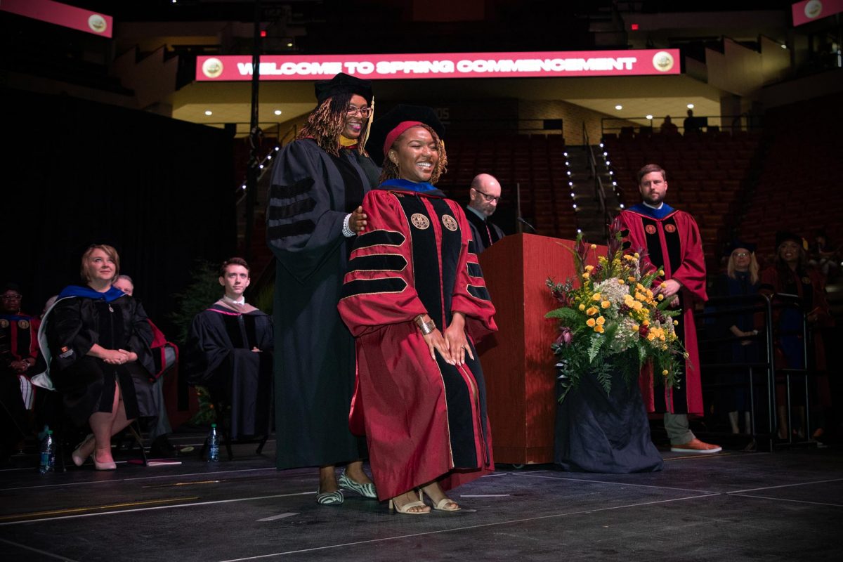 A Florida State University faculty member hoods a doctoral graduate at the spring doctoral hooding ceremony Friday, May 3, 2024, at the Donald L. Tucker Civic Center. (FSU Photography)