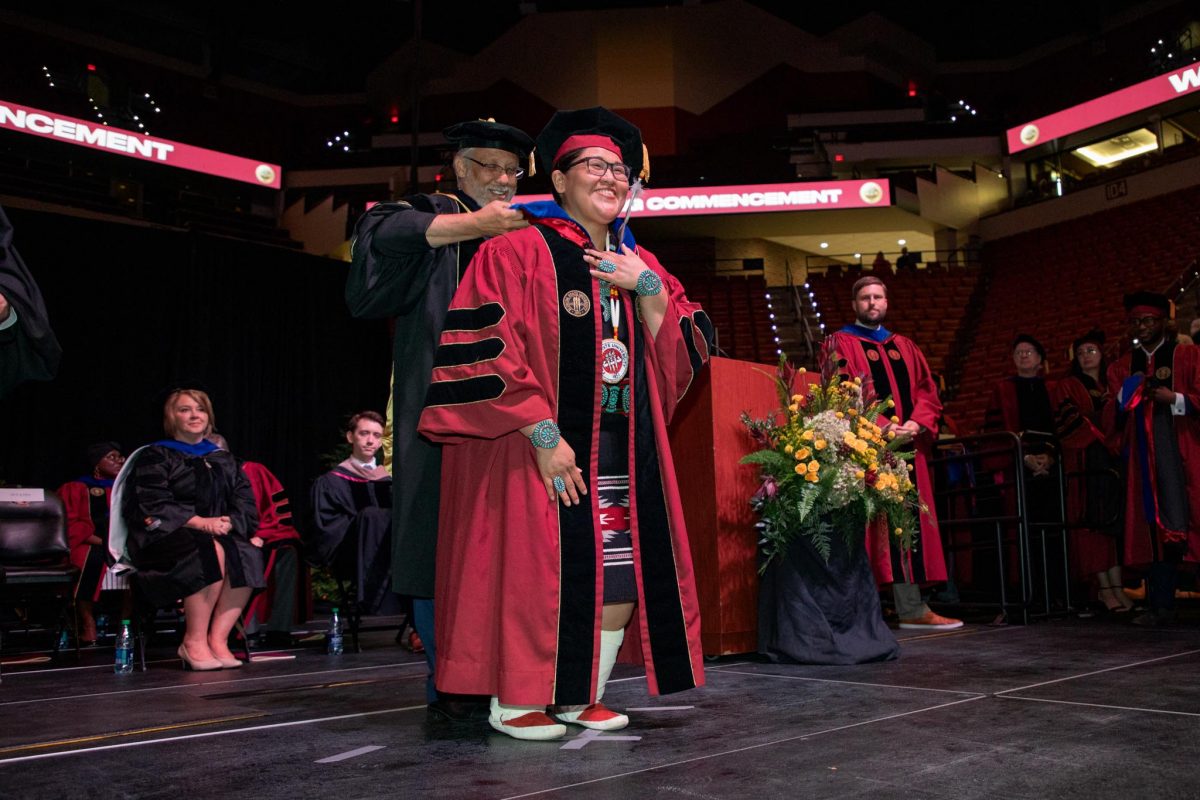 A Florida State University doctoral graduate receives their hood during the spring doctoral hooding ceremony Friday, May 3, 2024, at the Donald L. Tucker Civic Center. (FSU Photography)