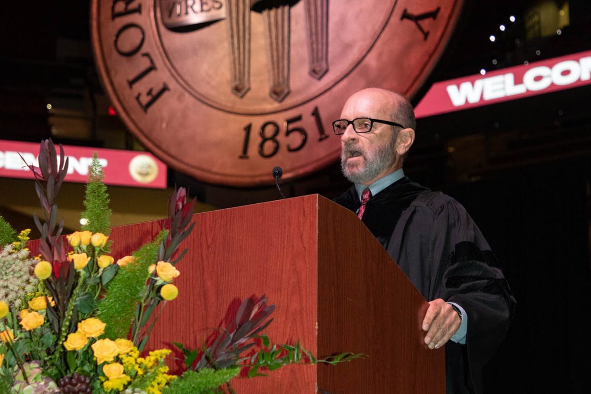 Senior Lecturer Mark Zeigler addresses the audience during one of FSU's spring 2024 commencement ceremonies Friday, May 3, at the Donald L. Tucker Civic Center. (FSU Photography)