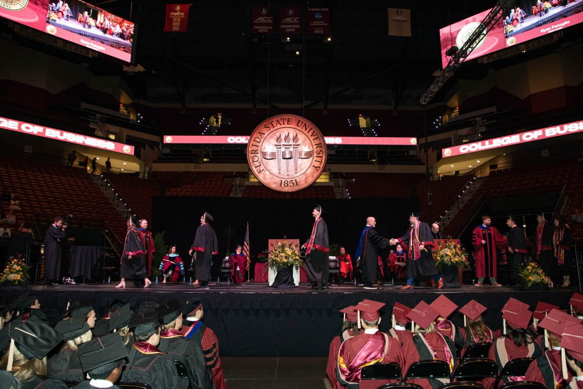Graduates walk across the stage during one of FSU's spring 2024 commencement ceremonies Friday, May 3, at the Donald L. Tucker Civic Center. (FSU Photography Services)