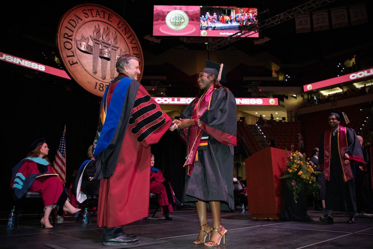 FSU President Richard McCullough congratulates a graduate during one of FSU's spring 2024 commencement ceremonies Friday, May 3, at the Donald L. Tucker Civic Center. (FSU Photography)